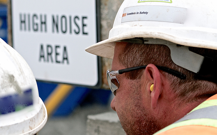 Construction worker with foam earplugs